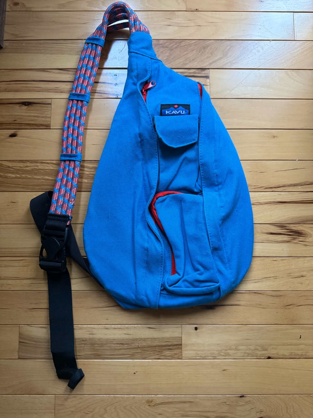 Kavu Blue Rope Sling Bag with Red Accents